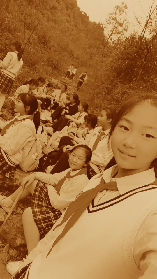 A graduation photo with a vintage film filter — the class photo turned 1972, sepia and faded